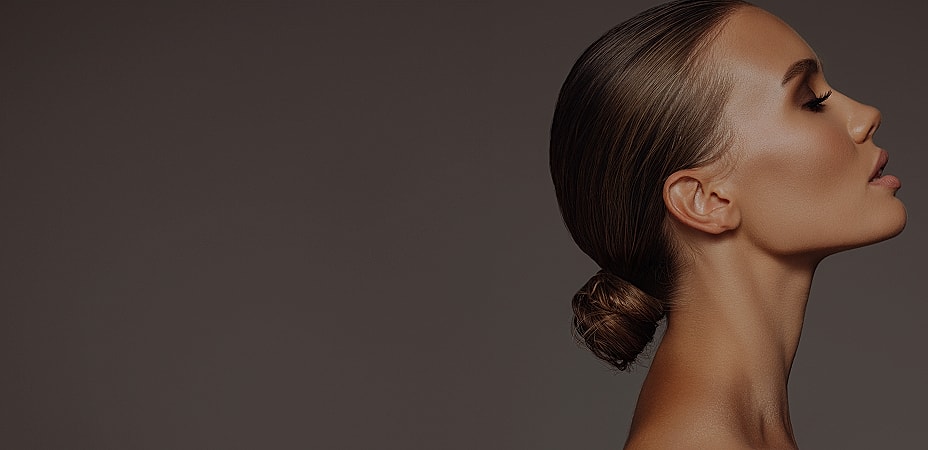 Profile of a woman with styled hair.