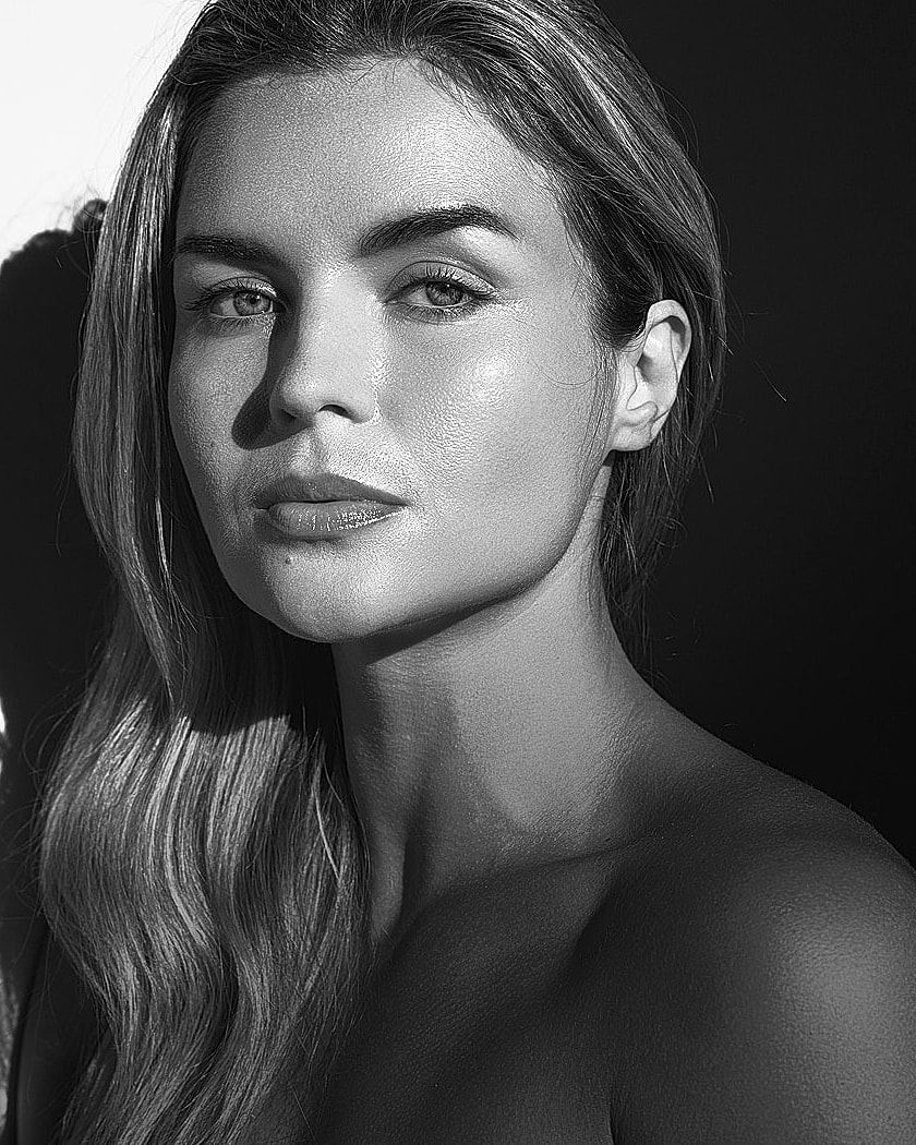 Stylish woman in sunglasses with leopard print skirt