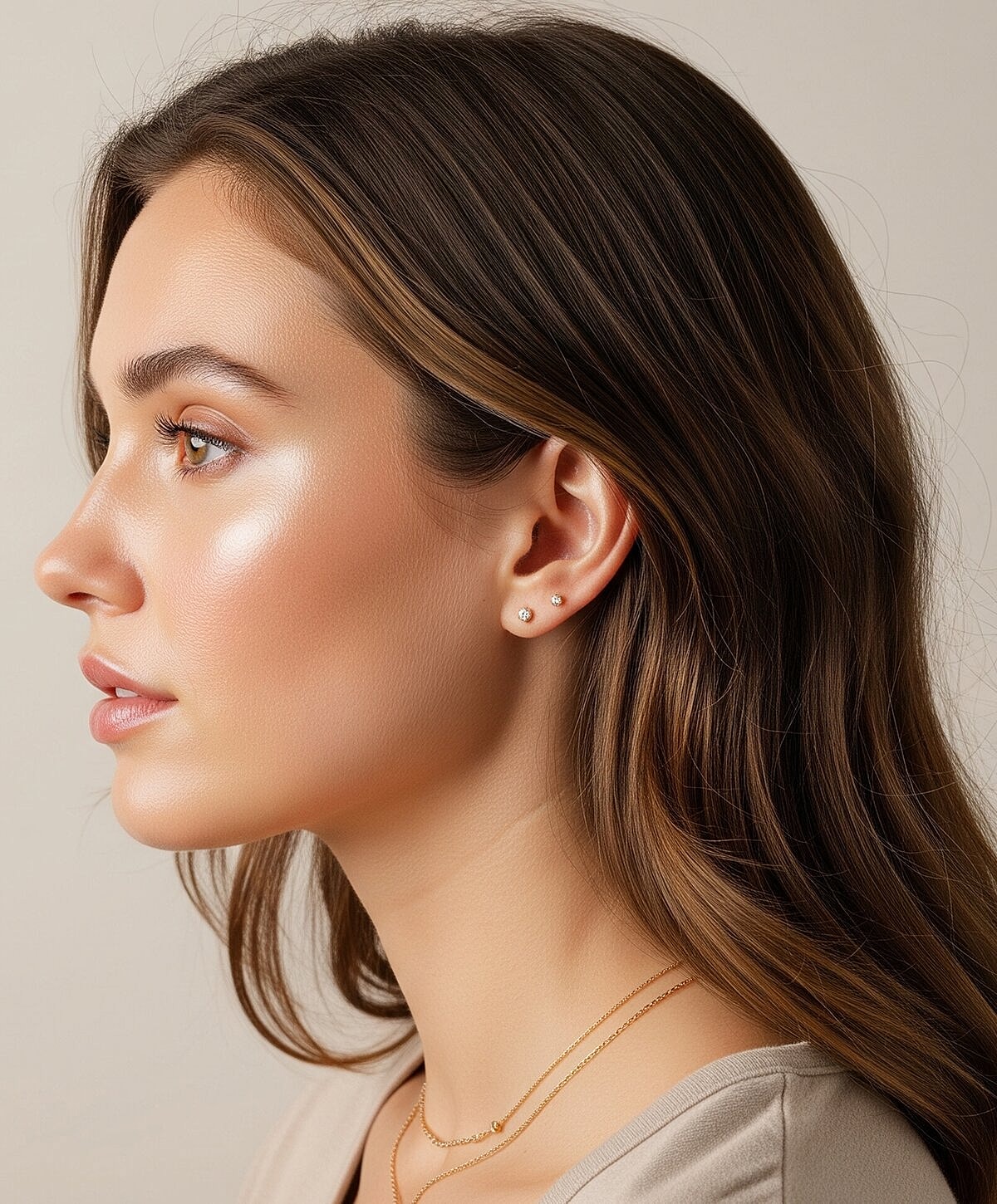 Model striking a pose against a textured wall.