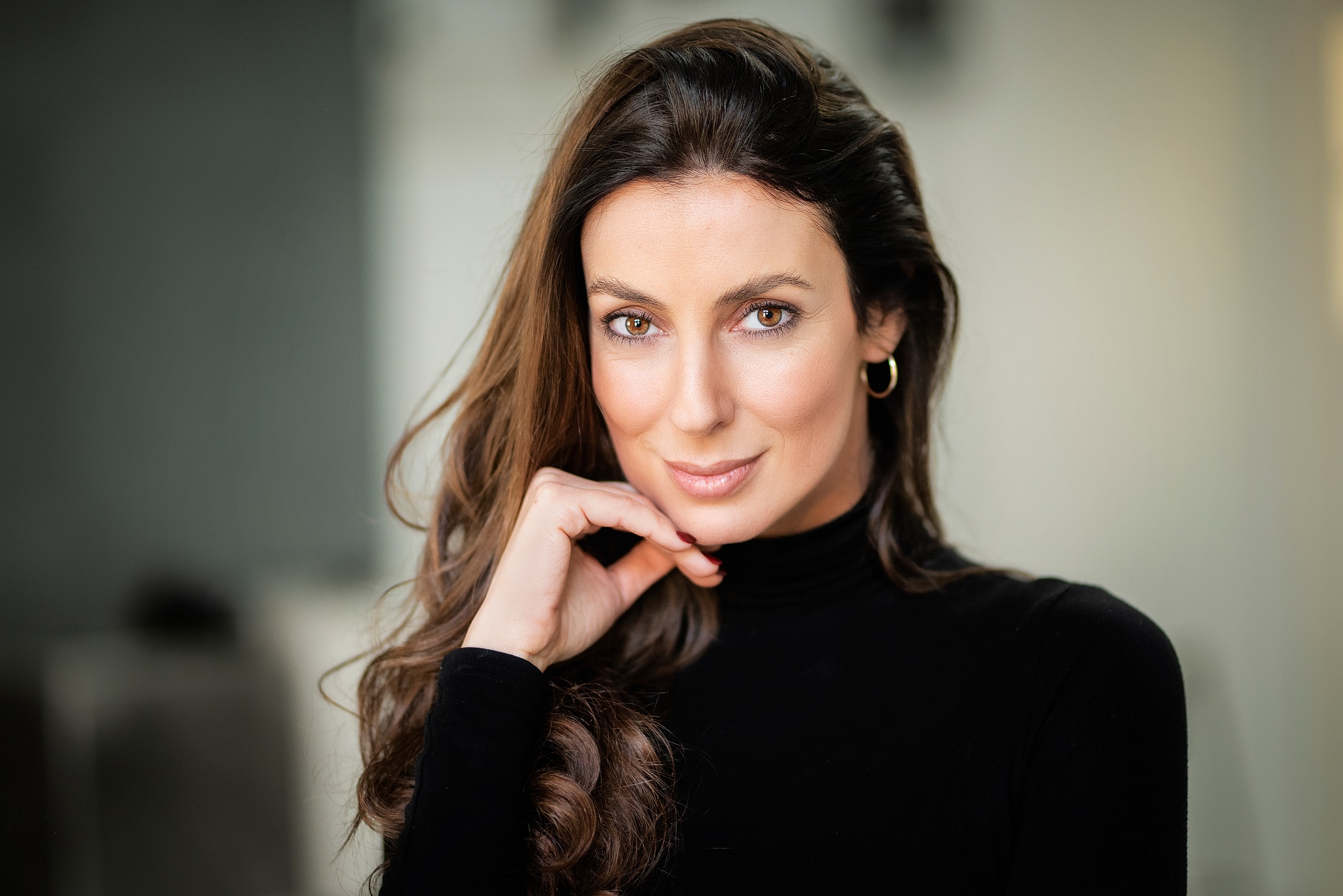 Profile of a woman with silver hair.