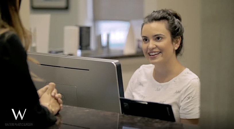News anchor delivering a report on camera.