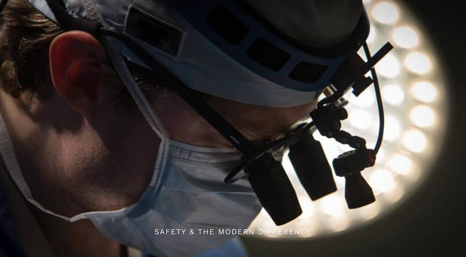 Surgeon performing surgery in an operating room.