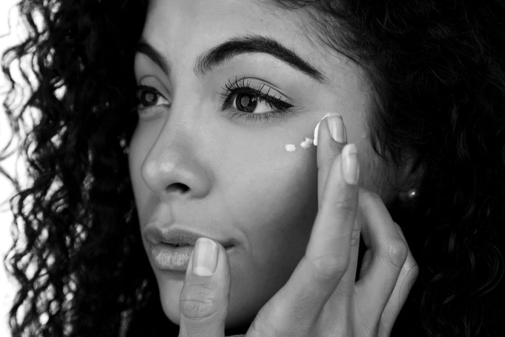 woman applying cold cream